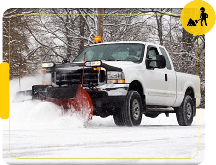 A white truck is driving down the road