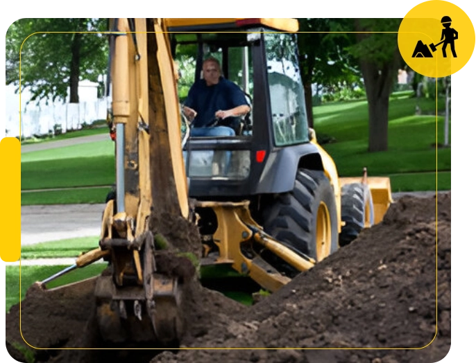 A man driving a tractor on top of dirt.