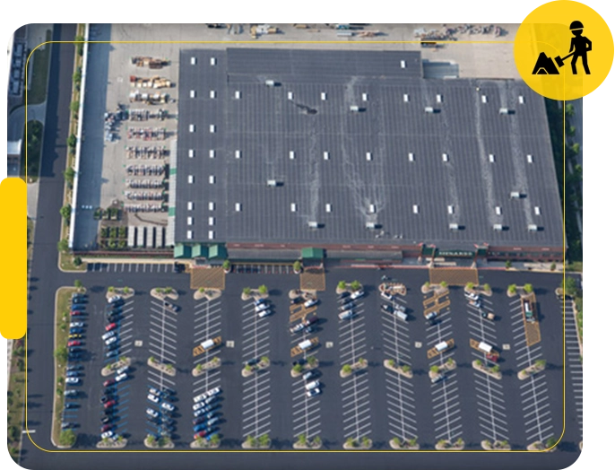 A large parking lot with many cars parked in it.